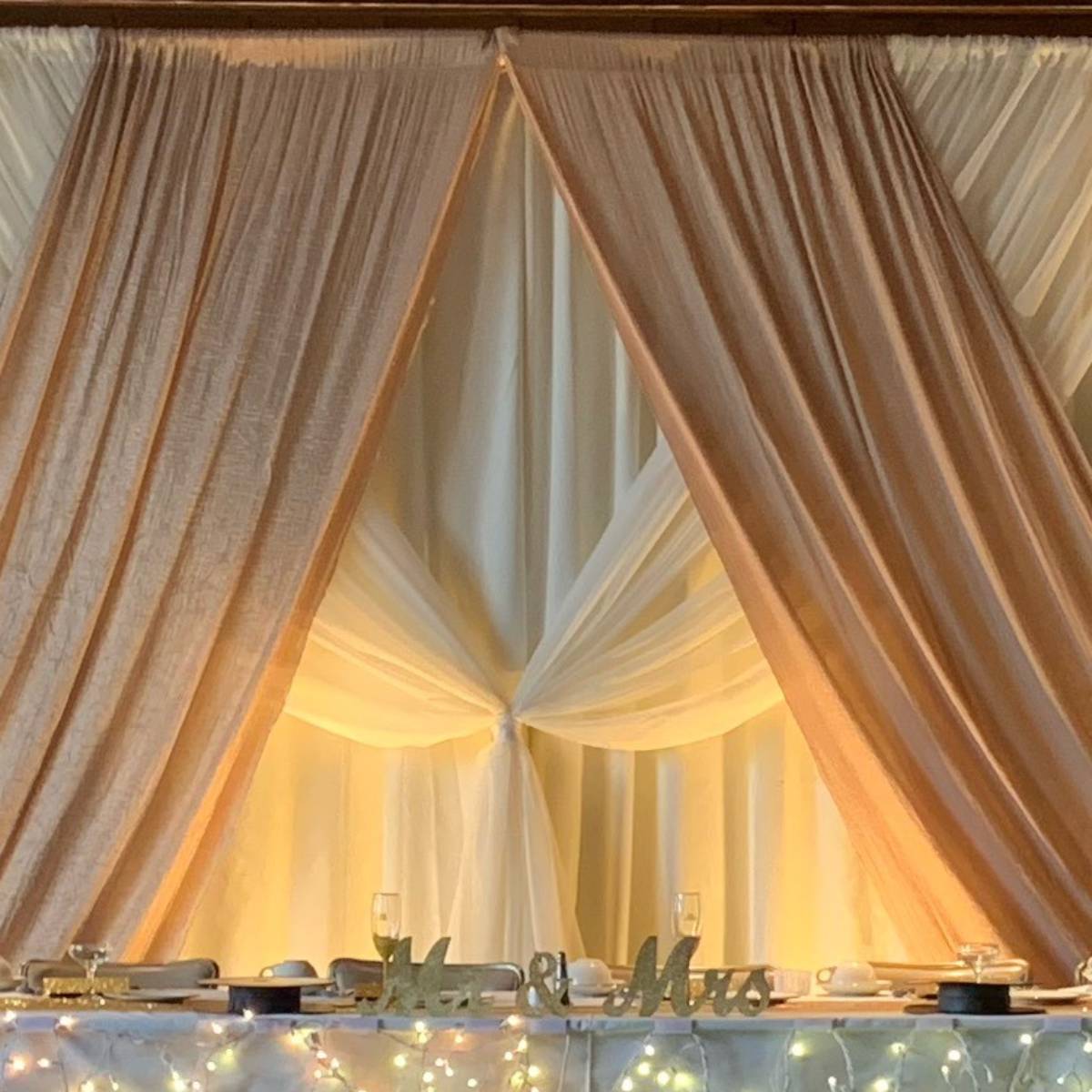 Ivory Bengaline Dual Panel Backdrop With Sheer Ivory Front Layer With Iridescent Crush Camel Accents With Uplights